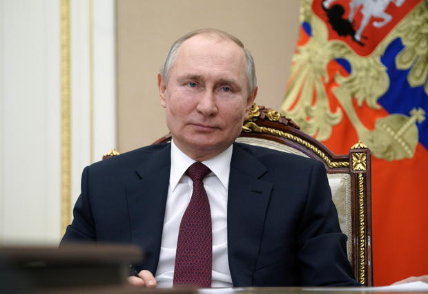 Russian President Vladimir Putin takes part in a video conference in Moscow 