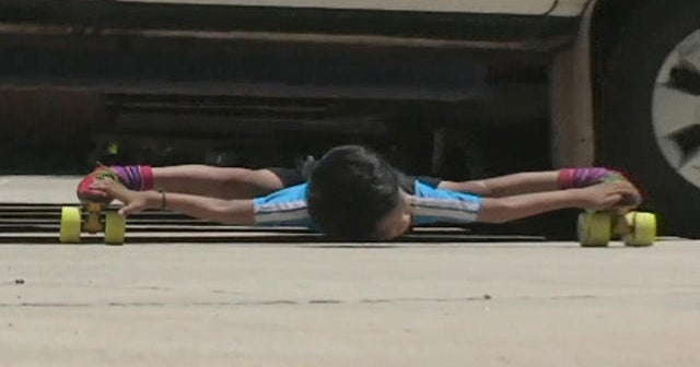"Limboskating" world record 6yearold passes under 39 cars on roller