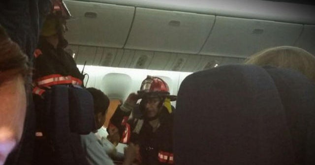 United Airlines midflight fire forces emergency landing CBS News