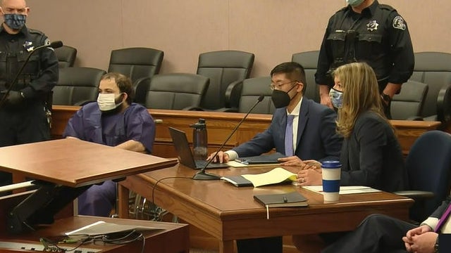 Ahmad Al Aliwi Alissa, seated left, appears in court in Boulder, Colorado, with his attorneys March 25, 2021. 