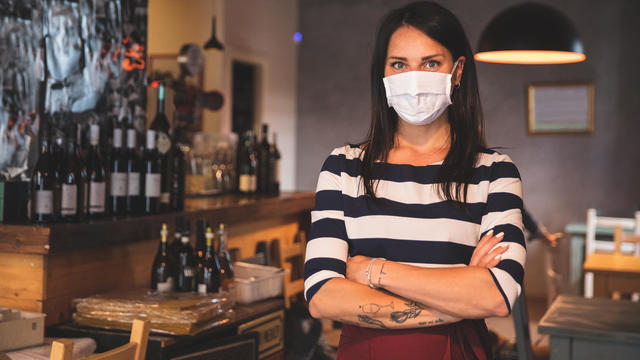 Barista portrait with protective face mask 