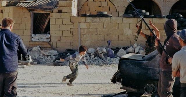 Dramatic video of boy rescuing girl in Syrian war zone a fake - CBS News