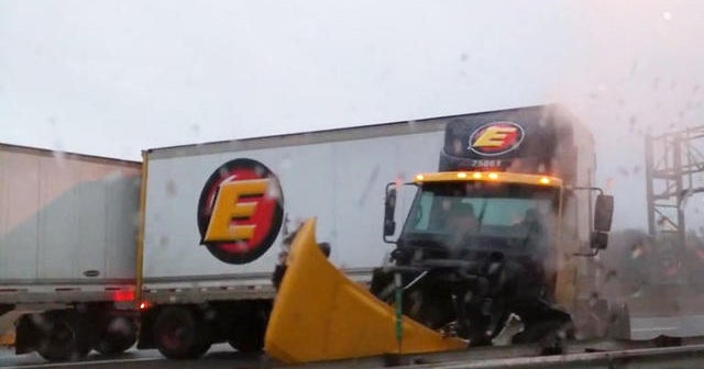Icy road sends big rig barrelling out of control - CBS News
