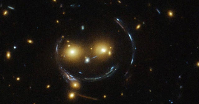 Smile! Galaxy cluster looks like one big smiley face - CBS News