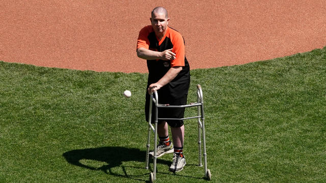 SF Giants: Bryan Stow throws first pitch, team unveils new uniforms