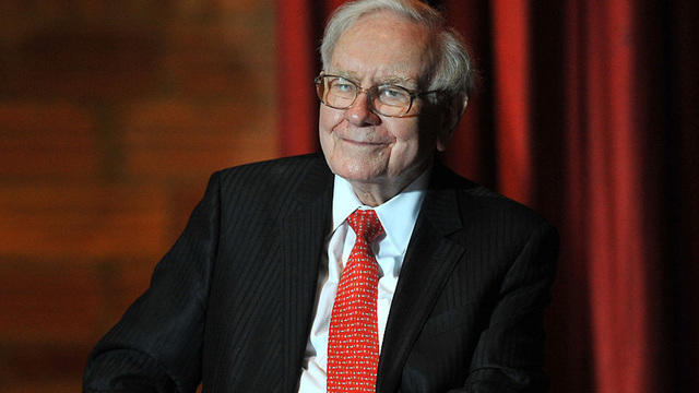 FILE PHOTO: Berkshire Hathaway shareholders walking by a video screen at the company's annual meeting in Omaha 