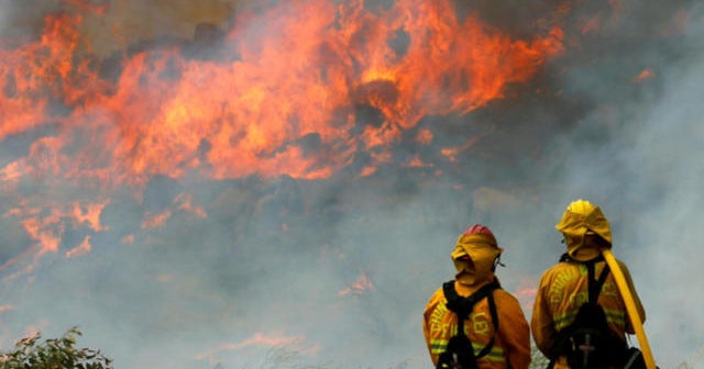 Enormous wildfires in California grow in heat wave - CBS News