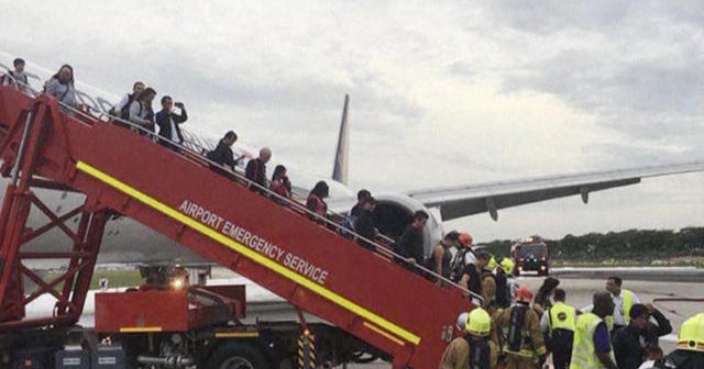 Airliner catches fire during landing CBS News