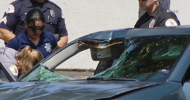 Suspect drives off with victim stuck in car windshield - CBS News