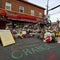 People lay flowers at a memorial in George Floyd Square 