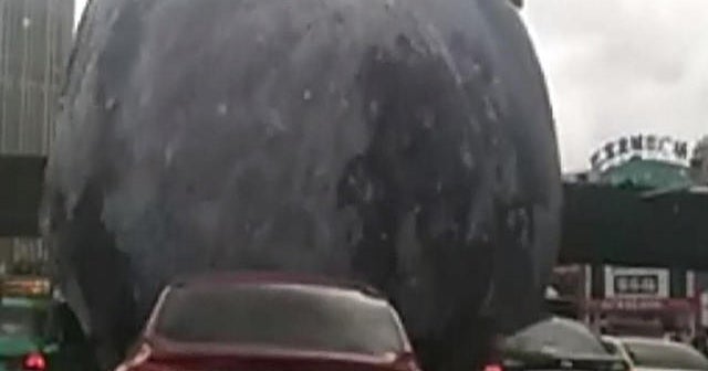 Typhoon sends giant inflatable moon for a joyride - CBS News