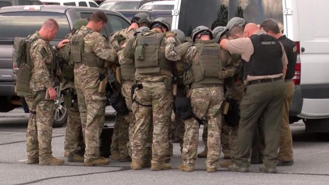 Sheriff's deputies are seen during a standoff in Boone, North Carolina, April 28, 2021. 