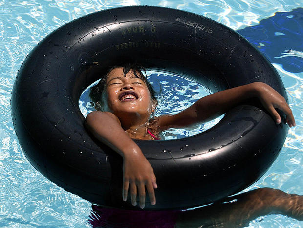 Monica Costello, 7, of North Hollywood, enjoys the sun beating on her face while taking part in a wa 