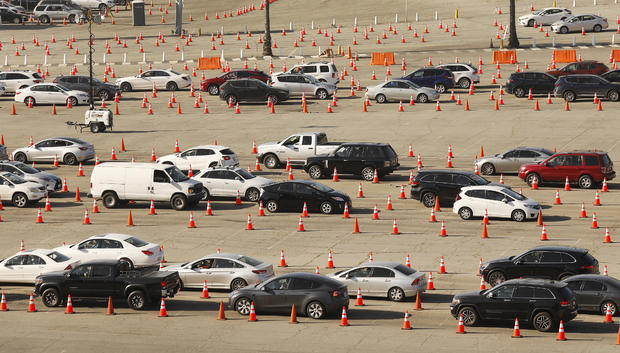 Vehicles wind their way through the parking lots at Los Angeles Dodger Stadium for COVID-19 vaccinations which is one of the largest vaccination sites in the country. 