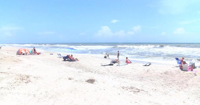 Man dies after being rescued from rip current at beach - CBS News