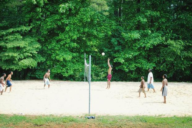 Group of people playing beach volleyball 
