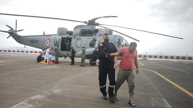 Indian Navy help people after cyclone Tauktae's landfall, in Mumbai 
