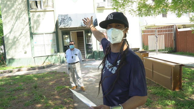 anthony-upshaw-in-front-of-his-apt-building.jpg 