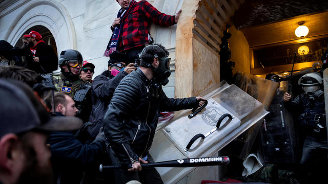 Protester wielding a baseball bat at January 6 Capitol riot 