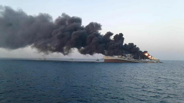 Smoke rises from Iran navy's largest ship in Jask port in the Gulf 