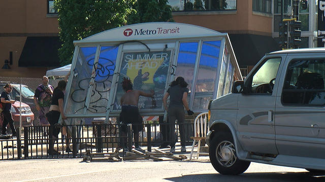 Uptown-Protesters-Use-Bus-Shelter-As-Barricade.jpg 