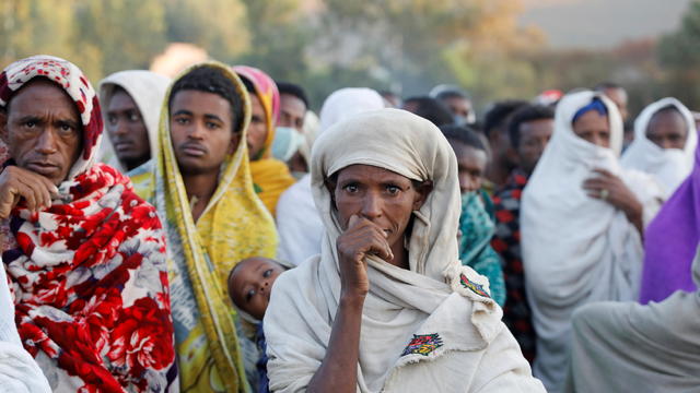 Women stand in line to receive food donations, at the Tsehaye primary school, in the town of Shire, Tigray region 