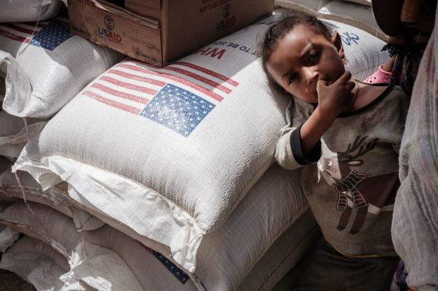 Child in Tigray waits to receive food aid 