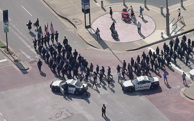 Dallas Police officers march in remembrance of 7/7/16 