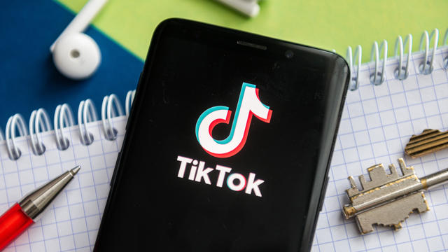 In this photo illustration, a Tik Tok logo seen displayed on 