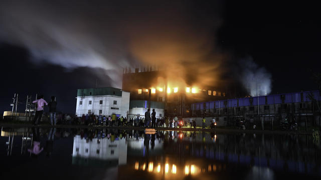 Firefighters try to extinguish fire inside the building 