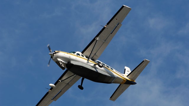 a Kenmore Air Cessna 208B Caravan with a baggage belly-pod on final-approach 