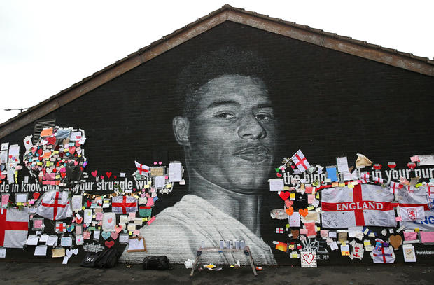 Defaced Mural Of Marcus Rashford Repaired By The Artist In Manchester 