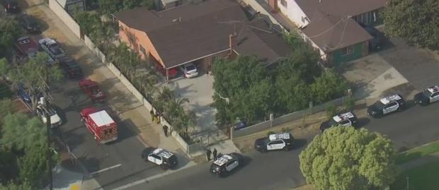 Woman Found Slain In Van Nuys Home, Suspect At Large 