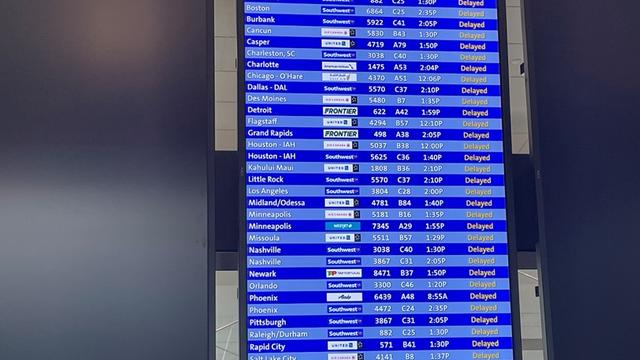 dia-flights-delayed-board-Blumer.jpg 