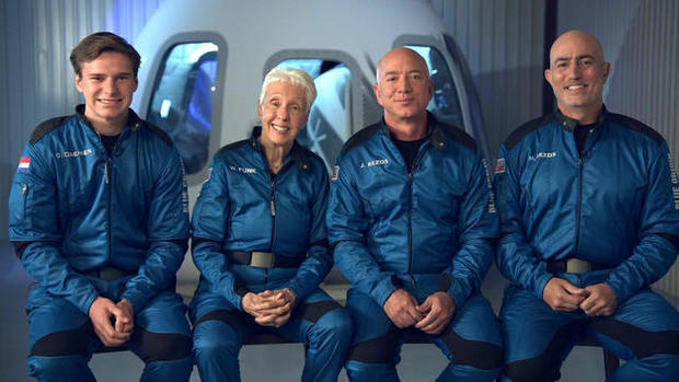 Jeff Bezos and Blue Origin crew members 