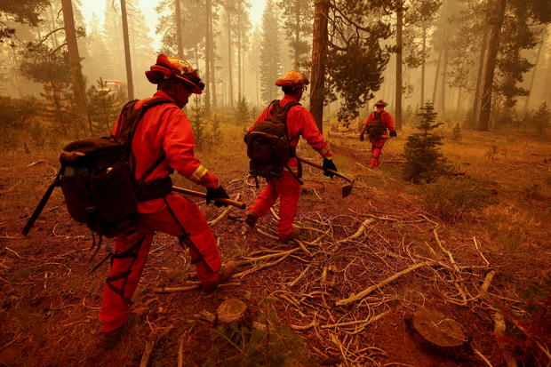 FILE PHOTO: Inmate firefighters watch for spot fires of the Dixie Fire in Westwood 