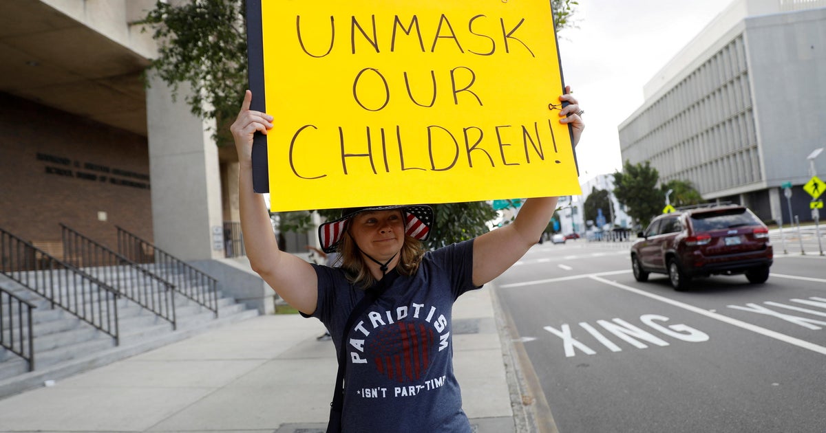 Pressure increases on school districts defying states' mask mandate ...
