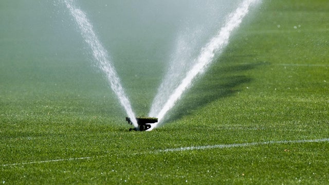 Sprinkler irrigates a soccer field 