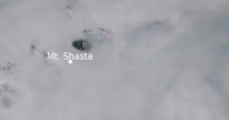 Satellite video shows Mount Shasta "poking its head" through wildfire