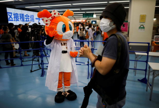Sister Giabbit, a mascot of the Japanese professional baseball team Yomiuri Giants, greets people at Tokyo Dome in Tokyo 