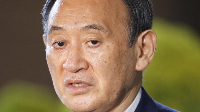 Japan's Prime Minister Yoshihide Suga speaks to media after he annouced to pull out of a party leadership race at his official residence in Tokyo 