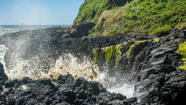 Waves crashing into the rocks at Devils Churn along the Oregon Coast, USA 