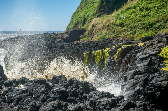 Waves crashing into the rocks at Devils Churn along the Oregon Coast, USA