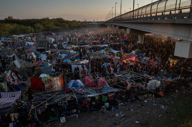 Migrants shelter near Del Rio International Bridge in Del Rio, Texas 