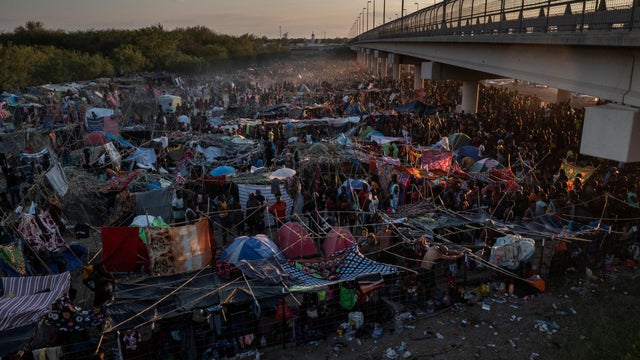 Migrants shelter near Del Rio International Bridge in Del Rio, Texas 