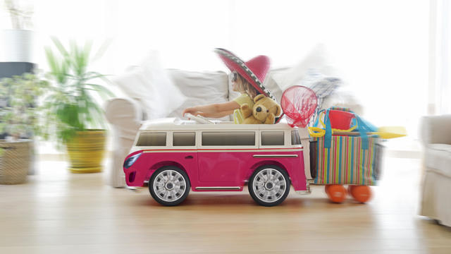 Child going on holiday in toy car 