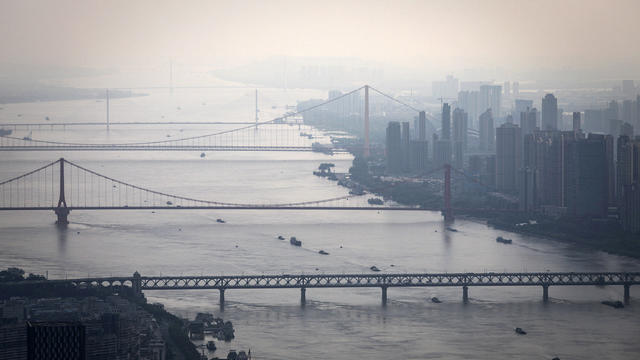 Bridges over the Yangtze River are seen from the Wuhan Greenland center during its construction August 11, 2020, in Wuhan, China. 