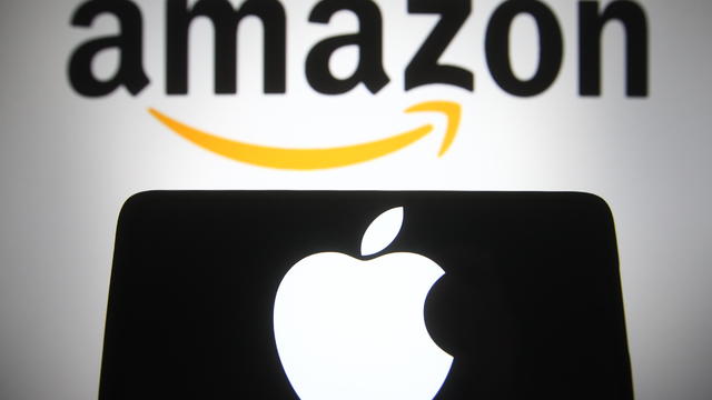 In this photo illustration, Apple and Amazon logos are seen 