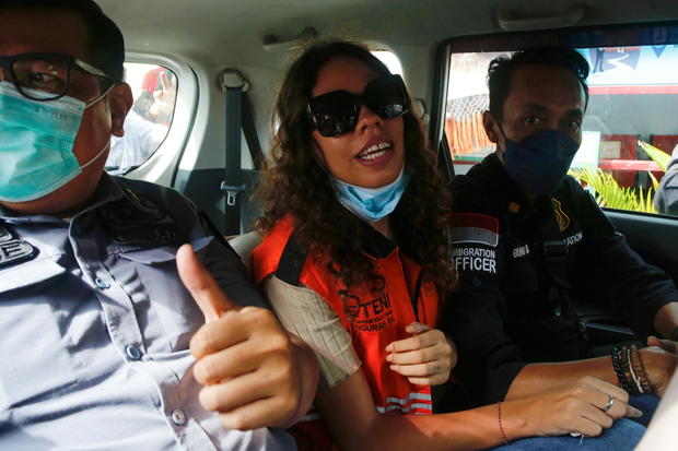 Heather Mack, an American woman jailed in 2015 with her boyfriend after being found guilty for playing a role in murdering her mother, is seen inside an immigration car, after being released from Kerobokan Prison in Denopasar 