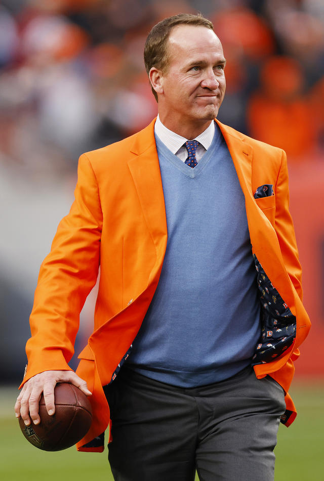 Peyton Manning Strutting His Denver Broncos Color Clad Suit and